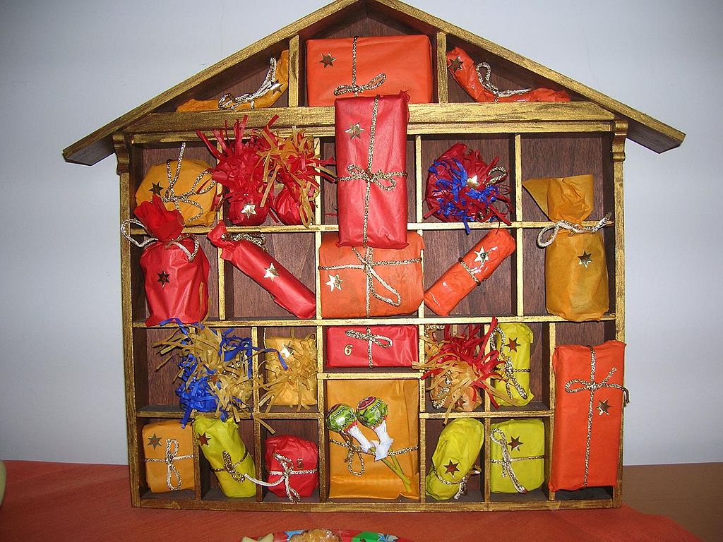 Advent calendar in shape of a house with colored present boxes
