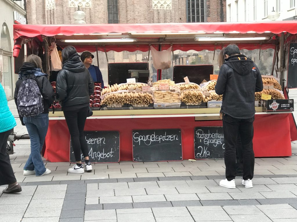 Stand selling asparagus in Munich pedestrian zone